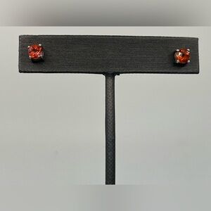 Sterling silver studs with unknown Orange Stone Earrings. Beautiful.  925